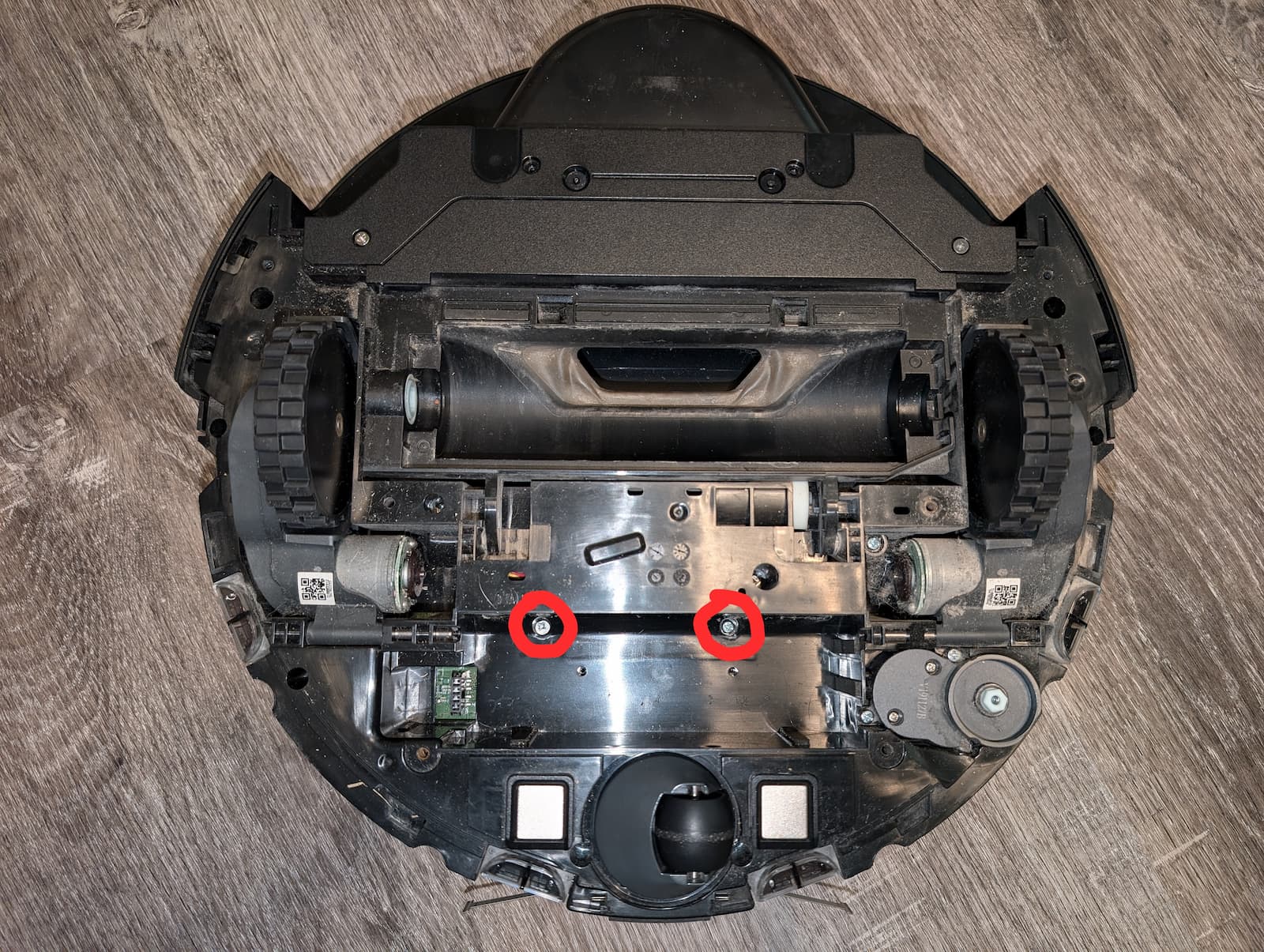 Two screws in the bottom of the battery compartment.